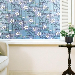 Frosted window film featuring white floral patterns on blue background for home privacy