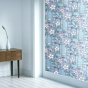 Frosted window film with white flower patterns for privacy and decorative glass art