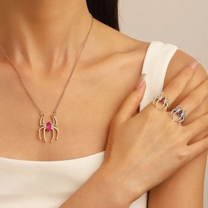 Punk style spider jewelry set with gothic red gemstone necklace and matching rings