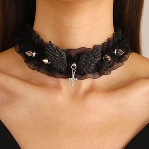 Close-up of Gothic lace choker with black wings, silver spikes, and zircon cross pendant