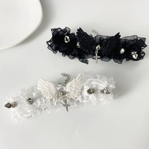 Gothic lace choker with metallic spikes, glitter wings and a crystal cross pendant
