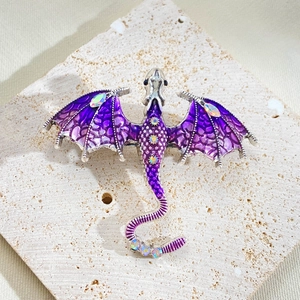 Vintage flying dragon brooch in purple enamel with colorful rhinestones on stone base