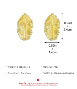 Detail showing golden leaf alloy earrings with realistic veins and 2.4cm by 1.4cm dimensions