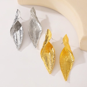 Exaggerated metal leaf earrings in gold and silver finish with realistic leaf texture