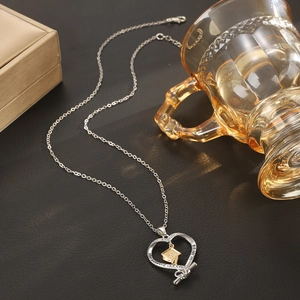 Graduation necklace with heart pendant, mortarboard charm and engraved inspirational quote