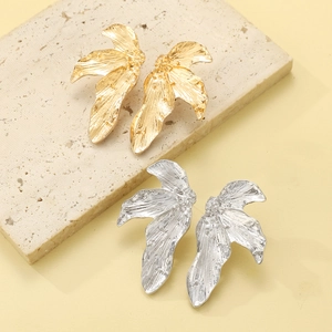 Minimalist alloy leaf earrings in gold and silver finish with hammered metal texture