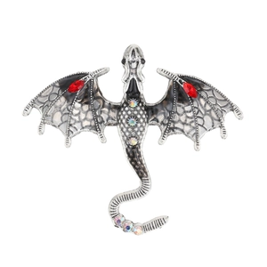 Vintage silver dragon brooch with black enamel wings and red marquise gemstones