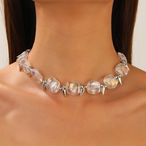 Close-up of hip-hop Z-letter necklace with iridescent beads and silver cone pendants