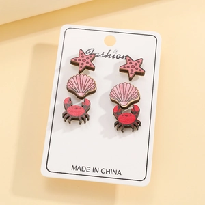 Ocean theme earring set with pink starfish, shell and red crab on wood print stud