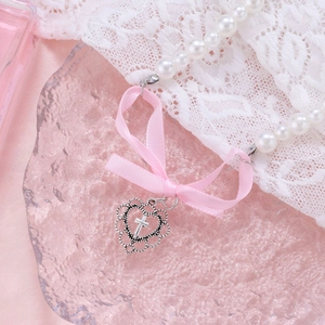 Pink ribbon bow pearl necklace with silver heart cross pendant in elegant setting