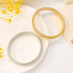 Elastic snake chain bracelets in gold and silver finish with polished metallic luster