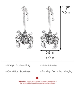 Detailed view of punk scorpion ear hooks in antique silver alloy with size measurements