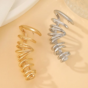 Minimalistische gouden en zilveren spiraal oorklemmen met modern geometrisch design