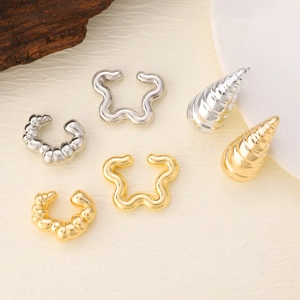 Detailed collection of minimalist oval hollow gold and silver plated ear clips and studs