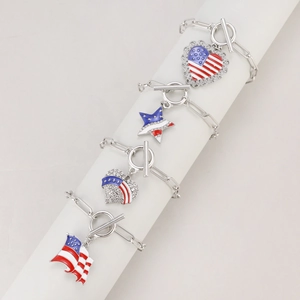 Detailed close-up of American flag charm bracelets with heart and star motifs on chain