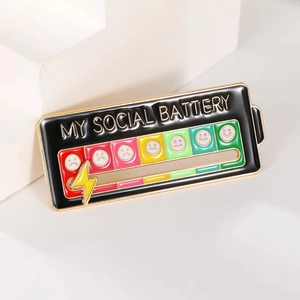 My Social Battery sliding enamel pin in black and gold showing mood levels