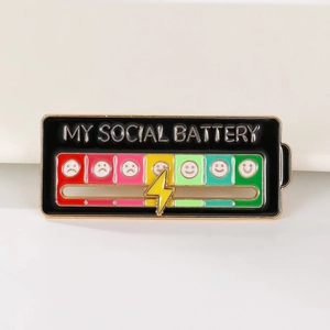 Detailed macro view of enamel social battery pin with sliding mood scale in zinc alloy
