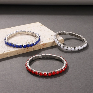 Detail view of red white and blue heart-shaped crystal stretch bracelets in silver settings