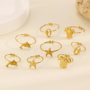 Detailed set of eight adjustable golden marine rings featuring starfish and turtles