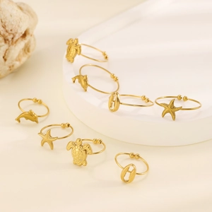 Gold starfish and turtle ocean themed open toe rings set with sea shell designs