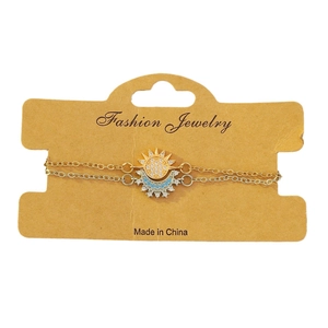 Elegante set van gouden zon- en zilveren maanarmband met sprankelende diamanten