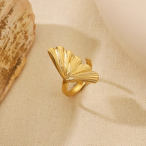 Macro detail of golden ginkgo leaf ring with fine textures and adjustable band