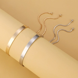 Minimalist adjustable cuff bracelets in polished gold and silver finish with box chains