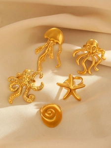 Detailed view of gold starfish octopus jellyfish shell open adjustable rings set