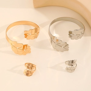 Polished metal leaf jewelry set with adjustable open rings and bracelets in gold and silver