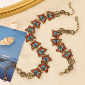 Detail of vintage steampunk butterfly choker with mechanical gears and bronze metal chain