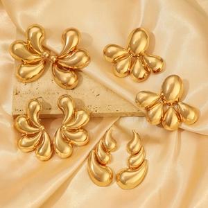 Golden flower and teardrop stud earrings set with highly polished metallic finish