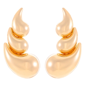 Detail of gold teardrop flower earrings with high-polish finish and fluid layered design