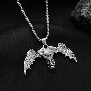 Gothic skull necklace with antique silver bat wings pendant on black lava stone