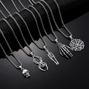 Gothic punk Halloween necklace featuring silver skeleton palm and spider web pendants