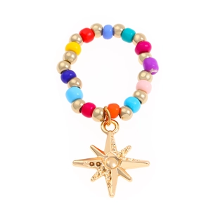 Handmade colorful beaded ring featuring a golden North Star pendant on a white background