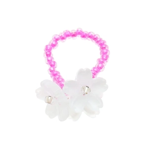 Detail of beaded ring with pastel pink beads and elegant white floral resin accents