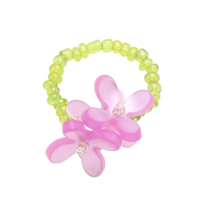 Detail of beaded ring with light green beads and pink resin flowers on white background