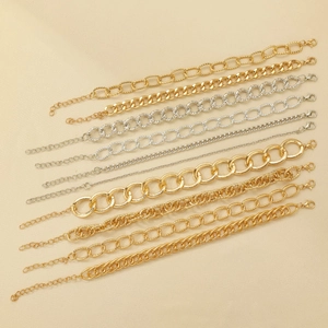 Detail showing gold and silver chain bracelet set with various chunky and thin links