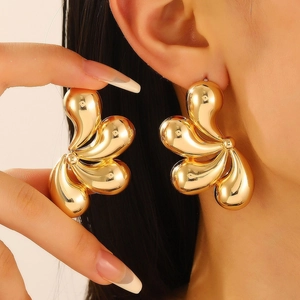 Exaggerated gold teardrop petal stud earrings for women in a bold metal floral design