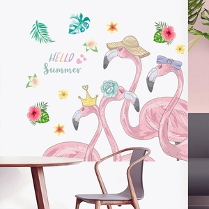 Detail of pink flamingos and tropical leaves wall decals in a Nordic living room decor