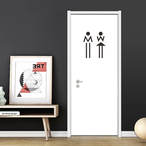 Insegne nere minimaliste per toilette con simboli astratti di uomo e donna su porta bianca
