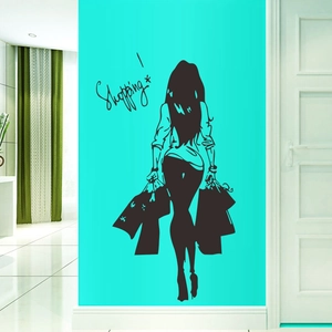Detail view of a black shopping girl silhouette wall decal on a vibrant teal background