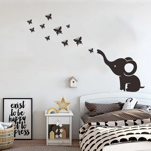 Cartoon elephant blowing butterflies wall decal for minimalist kids nursery room decor