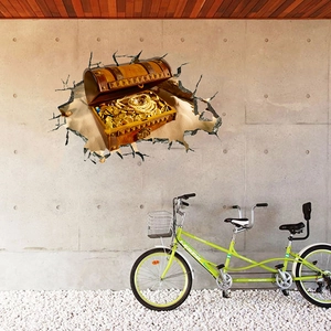 Sticker mural 3D détaillé montrant un coffre au trésor et des pièces sur un mur en béton