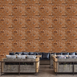 Detail of red-brown faux brick self-adhesive wallpaper in a rustic industrial interior setting