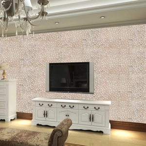 Detailed view of 3D pebble stone wallpaper in a living room with natural stone texture