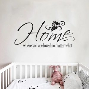 Sticker mural noir Home avec fleurs sur un mur blanc au-dessus d'un berceau de bébé
