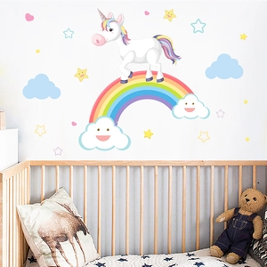 Cartoon rainbow unicorn wall decals for kids' room decoration in a nursery setting