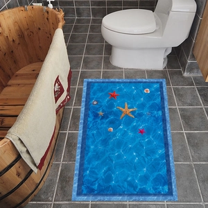 Detail view of a 3D ocean starfish and shell pattern on an anti-slip bathroom mat