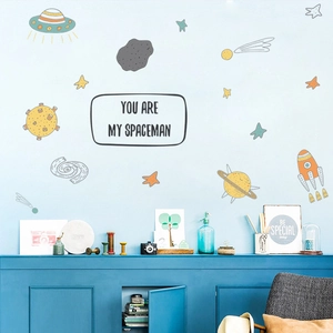 Detail of space theme wall stickers featuring UFO and YOU ARE MY SPACEMAN slogan